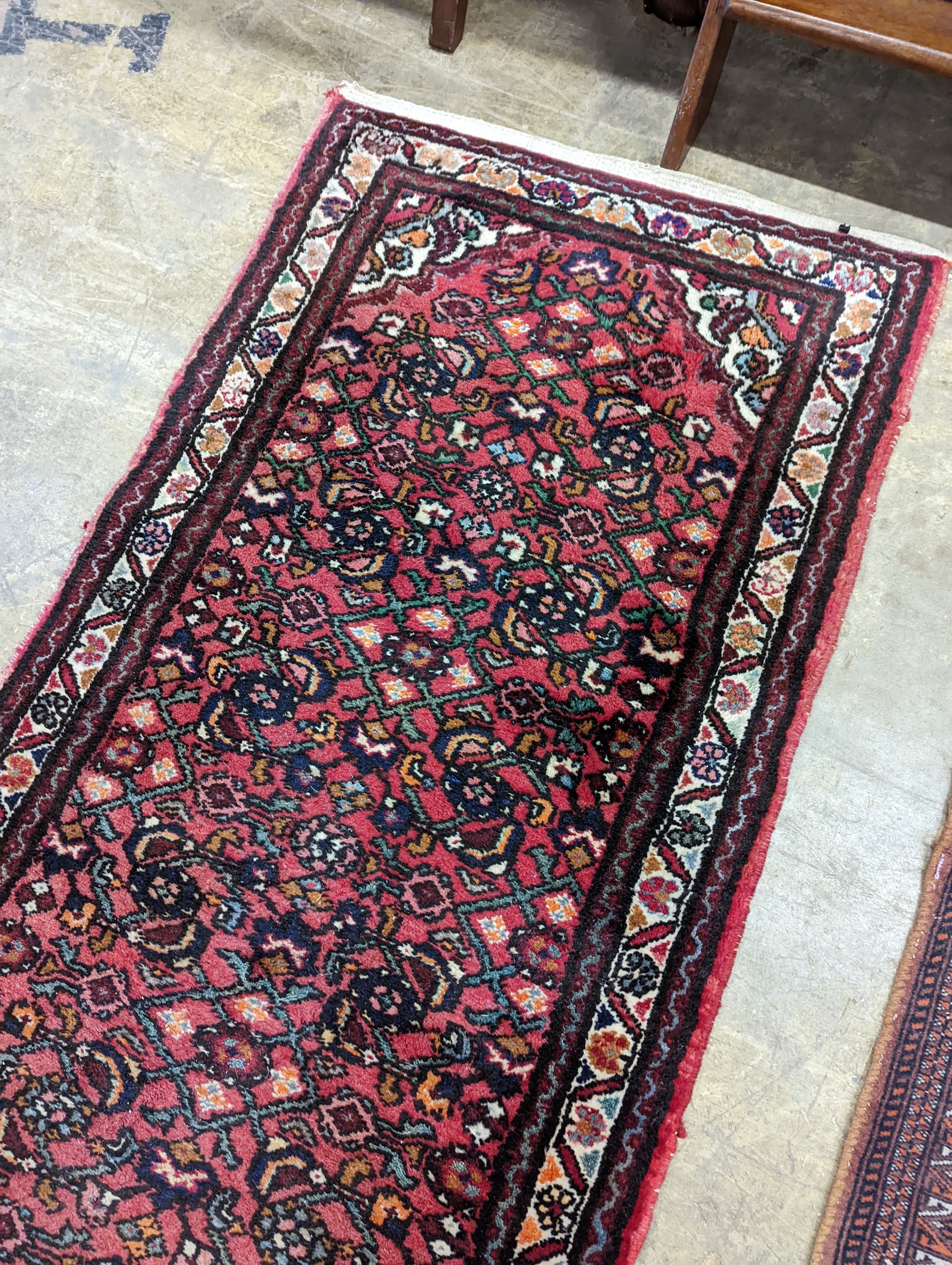 A North West Persian red ground runner and a Bokhara runner, larger approx. 290 x 78cm